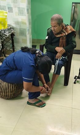 Caregiver providing emotional support to a senior resident
