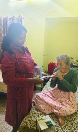 Caregiver supporting resident mobility and medicine routine