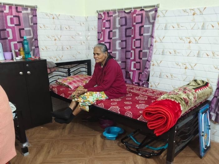 Caregiver supporting a senior resident